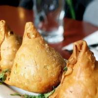 Samosa (2 Pieces) · Golden-fried flaky pastry puffs, stuffed with potatoes, peas, spices served with tamarind ch...