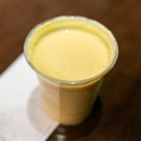 Mango Lassi · A delicious creamy , chilled drink with mango, yogurt, milk, a little sugar, and a sprinklin...