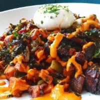 Bacon Hash · Hickory smoked country bacon, poached egg, sweet potato, roasted Hatch chiles, caramelized o...