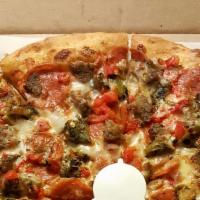 Chupacabra Pizza · Pepperoni, meatballs, green chile, fire roasted red peppers with a spicy marinara sauce.