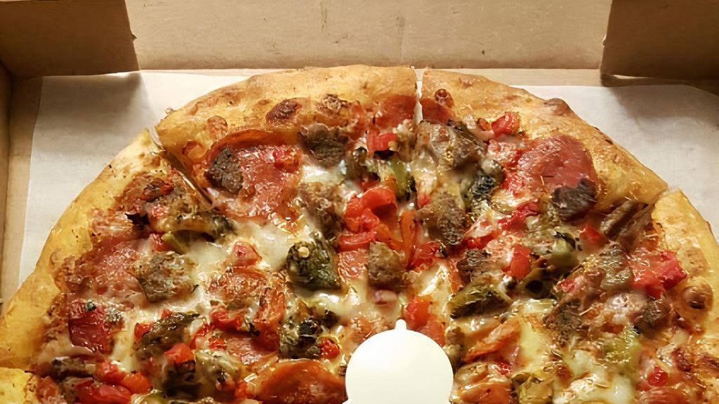 Chupacabra Pizza · Pepperoni, meatballs, green chile, fire roasted red peppers with a spicy marinara sauce.