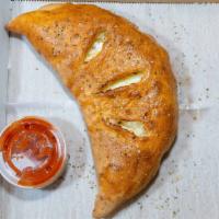 Cheese Only Calzone · Baked with mozzarella and ricotta cheeses and served with a side of warm original marinara.