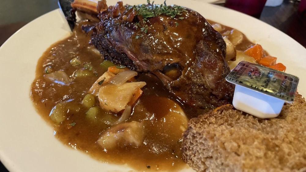 Declan’S Irish Stew · Our own special stew recipe fresh vegetables stewed in a rich broth with a slow-roasted bone-in lamb shank. Served with the Irish brown bread.