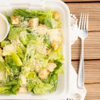 Traditional Caesar Salad* · Fresh romaine hearts chopped, tossed with our famous Caesar salad dressing, herb garlic crou...