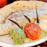 Quesadilla · Flour tortilla stuffed with cheese and choice of meat. Served with guacamole and sour cream.
