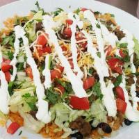 Burrito Bowl · Rice, beans, choice of meat, onions, cilantro, lettuce, tomato, cheese and sour cream served...