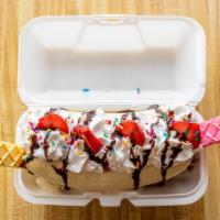 Banana Split Special · Three scoops of delicious ice cream is topped with whipped cream, fresh strawberry slices, w...