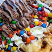 Canasta Special · Three scoops of ice cream are placed in a waffle bowl, and topped with fresh diced strawberr...