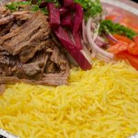 Beef Shawarma Rice Bowl · Marinated steak cut into thin slices, stacked and roasted on a vertical rotisserie. Topped w...