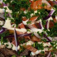 Beef Shawarma Fry Bowl · Marinated steak cut into thin slices, stacked and roasted on a vertical rotisserie. Topped w...
