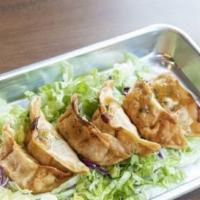 Mandoo (Potstickers) · Made with Chicken and vegetable. Comes with Sweet soy sauce on the side.