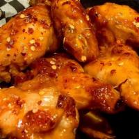 Chicken Wings · Baked wings, classic buffalo, garlic parmesan, mango habanero or sweet chili