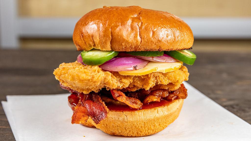 Baja Bbq Chicken · breaded chicken breast | applewood smoked bacon | smoked gouda cheese | red onion | fresh jalapeno | dill pickle | tangy bbq sauce | toasted fresh brioche