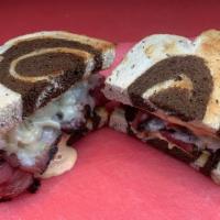 Classic Reuben · Pastrami, Swiss, Sauerkraut with a touch of Thousand Island Dressing on toasted Marble Rye B...
