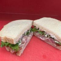 Hot Ham And Swiss · Thin slices of ham with melted swiss cheese, mayo, lettuce, tomato and ranch dressing on our...
