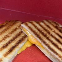 Classic Grilled Cheese · Cheddar cheese melted to perfection served on toasted white bread