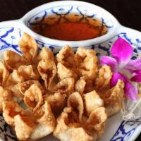Crab Wonton · Deep fried wontons stuffed with crab meat and cream cheese served with our special sauce.