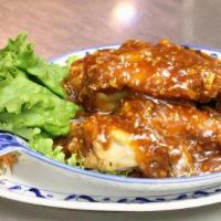 Garlic Wings · Buffalo wings marinated in fresh garlic and herbs deep fried and cooked over red wine sauce.
