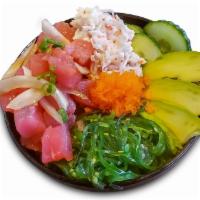Poke Bowl · Rice topped with poke tuna, seaweed salad, crab salad, avocado, cucumber, and masago.