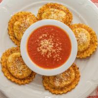 Fried Ravioli (5) · Cheese ravioli, breaded and deep fried to a golden brown and served with a side of marinara ...