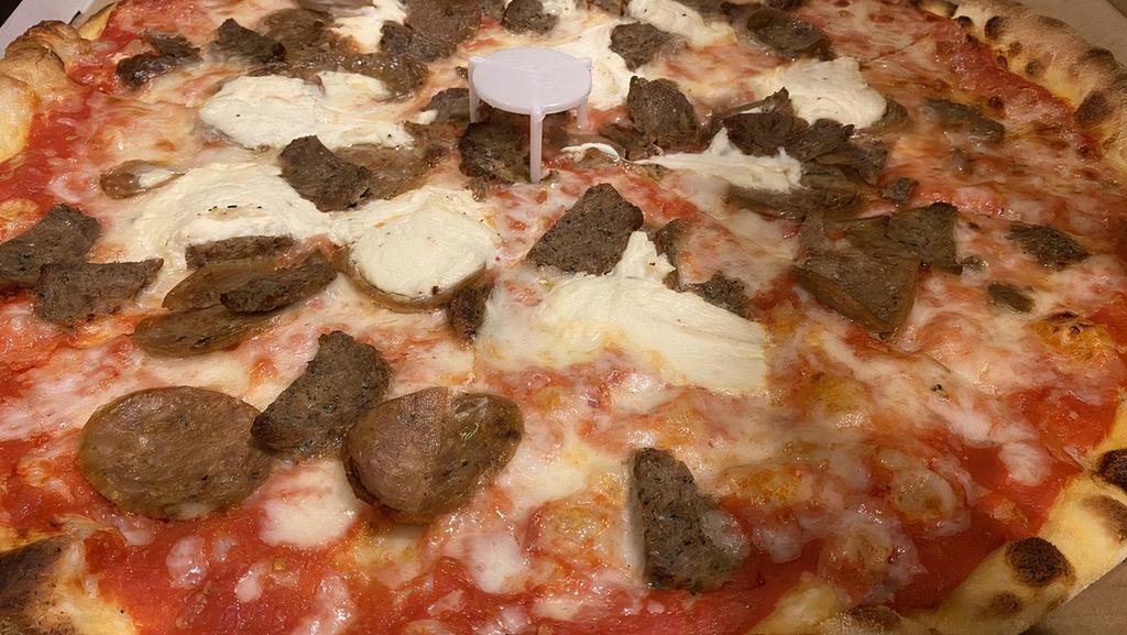 Lasagna Pizza · Sausage, meatballs, ricotta, mozzarella cheese and pizza sauce.
