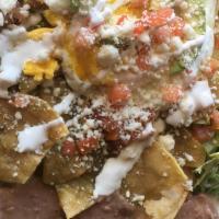 Chilaquiles · Fried tortillas(totopos) stir with freshly made salsa Verde or roja. Topped off with an egg,...