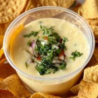 Queso Dip  · A rich and velvety Tex-Mex style cheese dip (12 OUNCES). Flavor packed with green peppers, r...
