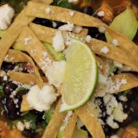 Chicken Tortilla Soup · Hand shredded chicken in its own broth topped with Mexican herbs and fried tortilla strips.