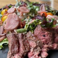 Gorgonzola Steak Salad · 6oz Snake River Farm Wagyu Skirt Steak. Mixed greens, Cherry tomato, Pickled onions, Gorgonz...