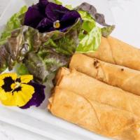 Fried Veggie Roll · Deep fried spring rolls stuffed with carrots, cabbage, and glass noodles. Served with plum s...