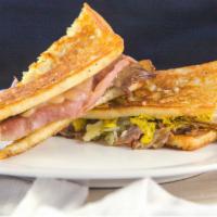 Cuban · House-roasted spiced pork, french madrange ham, swiss cheese, house-made spicy mustard, topp...