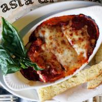 Meat Lasagna · Baked meat lasagna with meat sauce, topped with Mozzarella cheese.