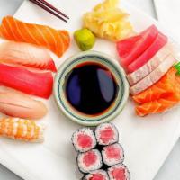 Sushi & Sashimi · Five pieces sushi and six pieces sashimi and tuna roll.