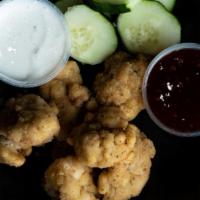Boneless Wings · Gluten-free breaded chicken, cucumber and choice of two sauces
