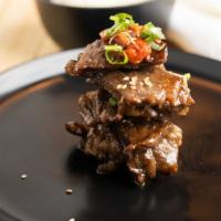 Manna Galbi · Thin beef ribs marinated in korean bbq sauce.