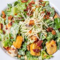Caesar Salad · Fresh Cut Romaine tossed in Caesar dressing, parmesan cheese and croutons.