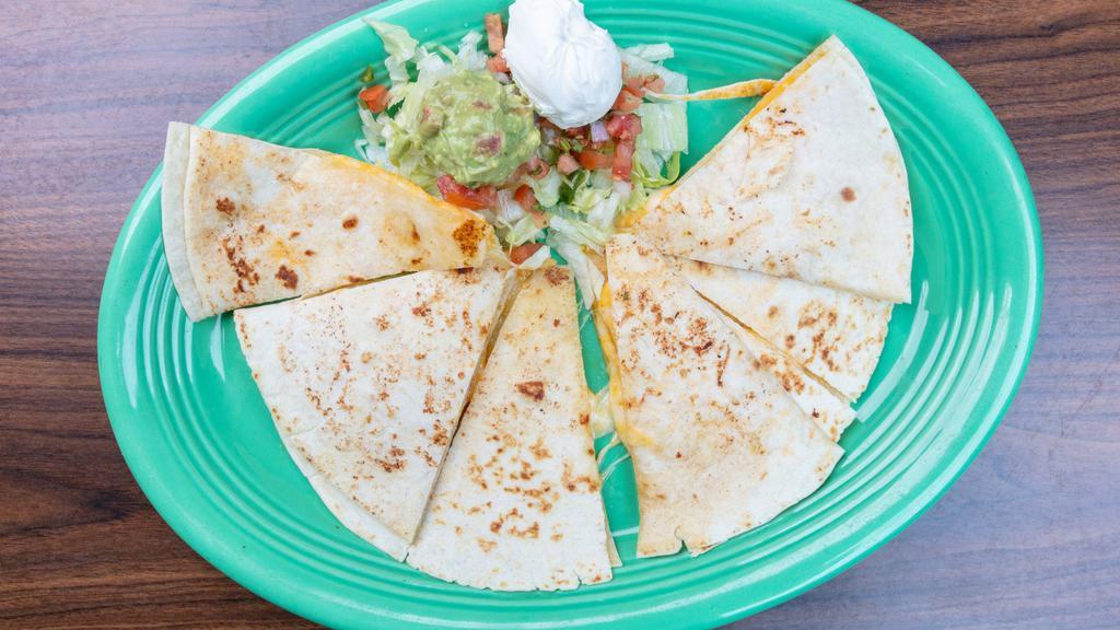 Daniel'S Quesadilla · Large flour tortilla, stuffed with Cheddar and Jack cheese, your choice of steak or grilled chicken with mushrooms. Served with guacamole, sour cream and tomatoes.