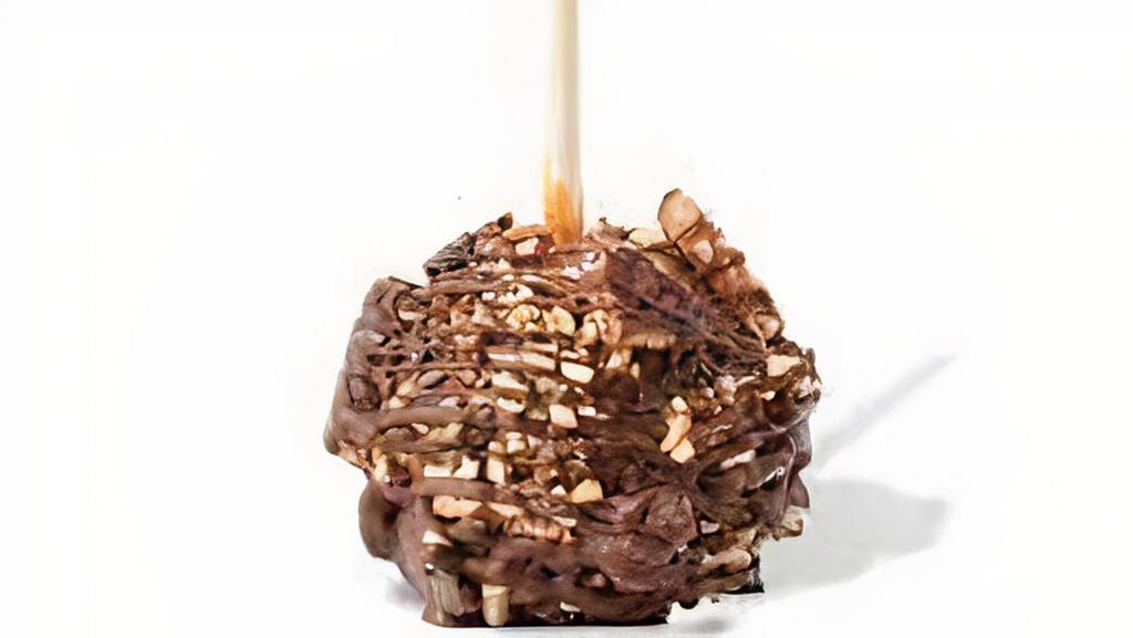 English Toffee Apple · Caramel-covered granny smith apple rolled in almonds and toffee pieces, drizzled with milk chocolate.