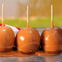 Plain Caramel Apple · nothing but thick and chewy caramel on a crisp Granny Smith apple on this old-fashioned favo...