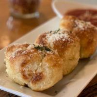 Garlic Knots · House made, tossed in garlic butter and parmesan cheese, served with marinara.