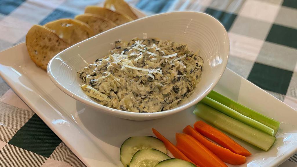 Spinach Artichoke Dip · House-made spinach artichoke dip, served with veggies and crostini.