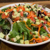House Salad · Romaine, mixed greens, tomato, carrot, red onion, cucumber, garlic vinaigrette.