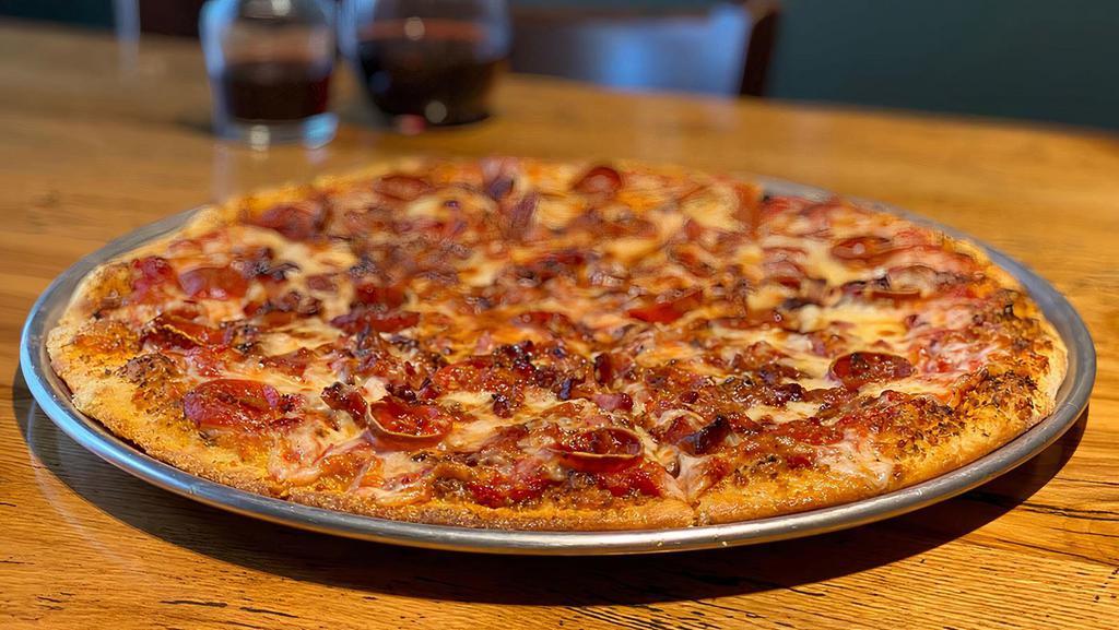 Meat Lovers · Pepperoni, ham, bacon, andouille sausage, parsley, parmesan.