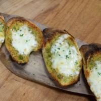 Garlic Bread · House baked baguette with butter garlic spread and cheese