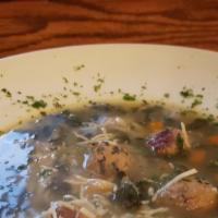 Italian Wedding Soup · Meatballs, orzo, spinach, onions, celery & carrots in a chicken broth finished with Parmesan...
