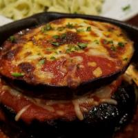 Eggplant Parmigiana · Eggplant slices layered with cheeses, Housemade San Marzano sauce; served with a side of han...