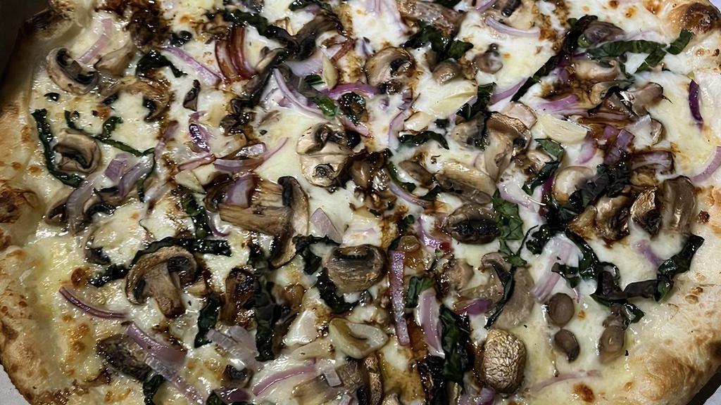 Mushrooms Pizza · Crimini, portobello, mushrooms medley with kale, onions, mozzarella and finished with a balsamic reduction drizzle and truffle oil