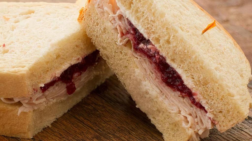Turkey Breast & Cranberry · Served on your choice of bread with Mayonnaise, Cranberry Sauce, Turkey Breast, Cream Cheese. (Pickles & Sliced Red Onions on request)