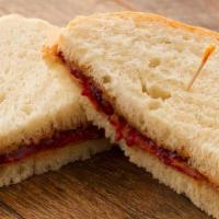 (Kids) Peanut Butter & Jam · Served on our thin-sliced Honey White Bread with Peanut Butter & Strawberry Jam.