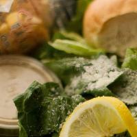 Caesar · Romaine Lettuce, Parmesan Cheese, Lemon Slice, Seasoned Croutons with Creamy Caesar dressing...